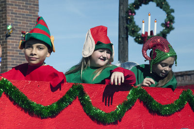 Image: More elves are ready to help Santa during the parade as it passes thru downtown Italy.