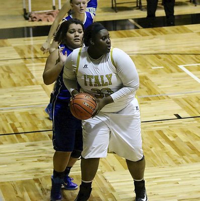 Image: Lady Gladiator Cory Chance(33) tears down an offensive rebound against Venus.