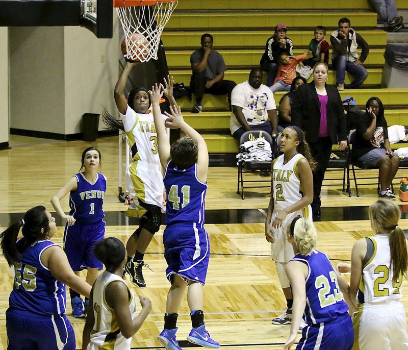 Image: Italy senior Kortnei Johnson(3) attacks Venus along the baseline.