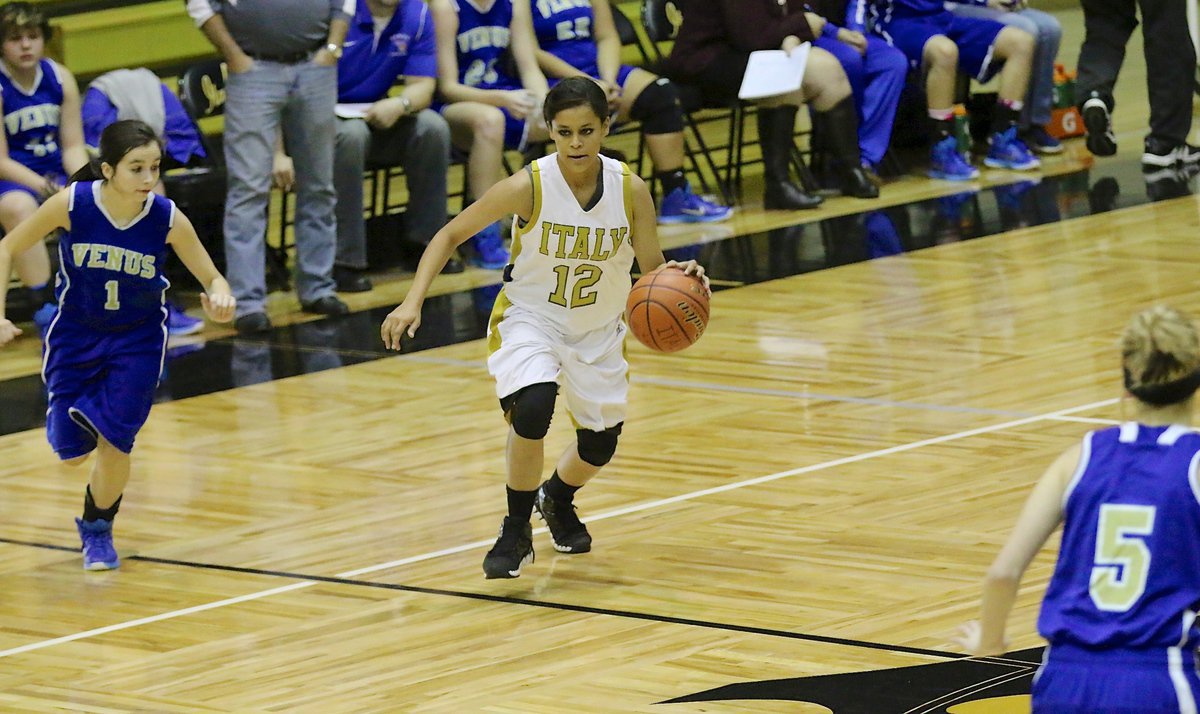 Image: Alex Minton(12) pushes the ball up the court for the Lady Gladiators.