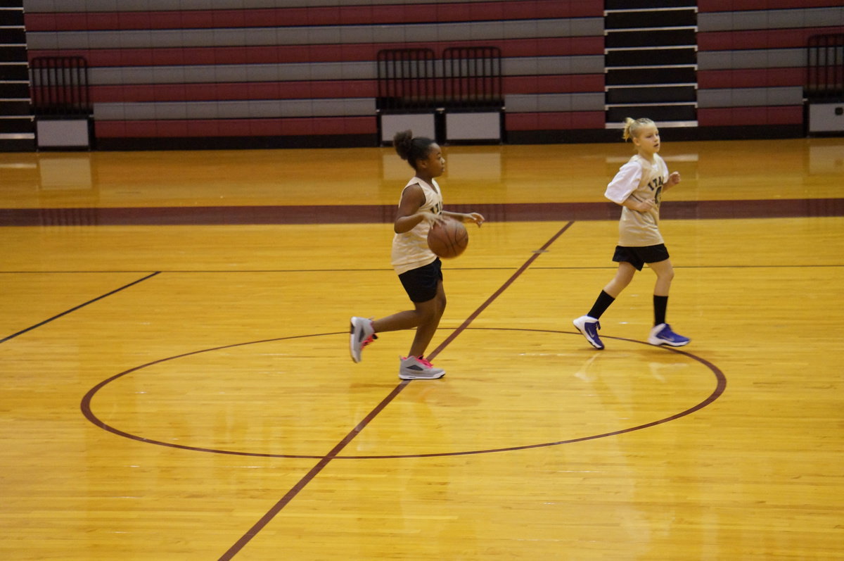 Image: Jada Williams takes the ball down the court for the Gladiators.