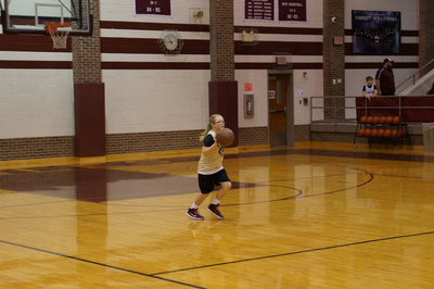 Image: Gabi drives the ball down court.