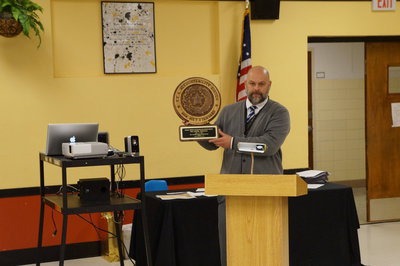 Image: Mr. Joffre holds up the award for the Italy High School