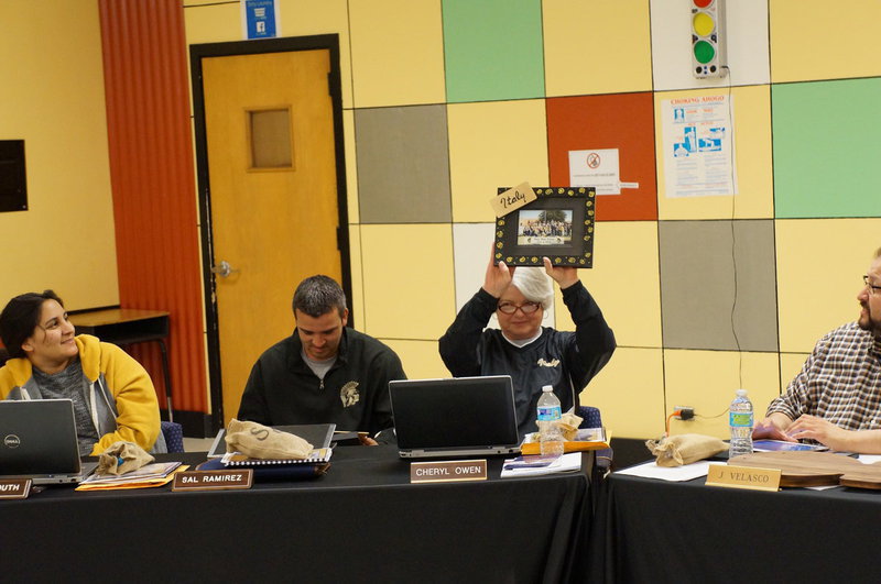 Image: Cheryl Owen holds up one of the gifts the art class made.