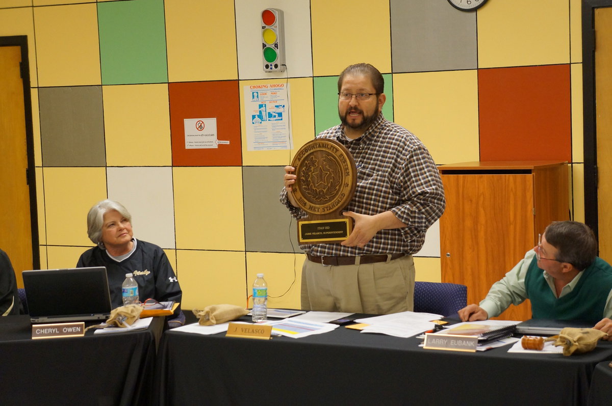 Image: Mr. Valasco holds up the award for the Italy ISD.