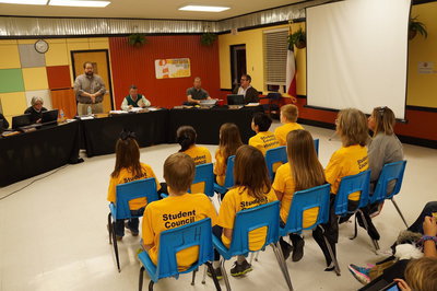 Image: Student council watches as the school board meeting starts.