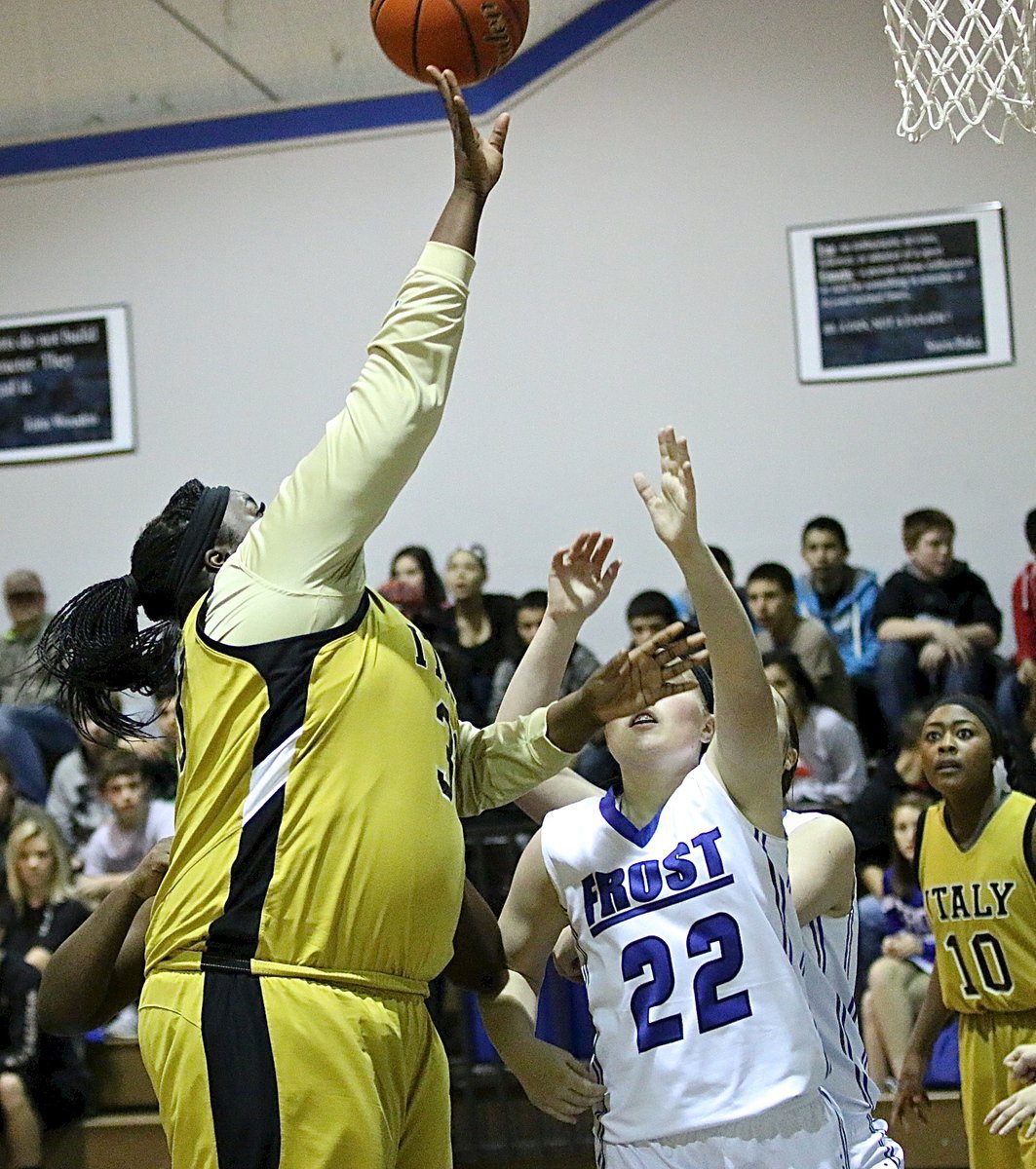 Image: Frost struggles to handle Italy’s power inside as center Cory Chance(33) rises up for her second straight basket to start the game.