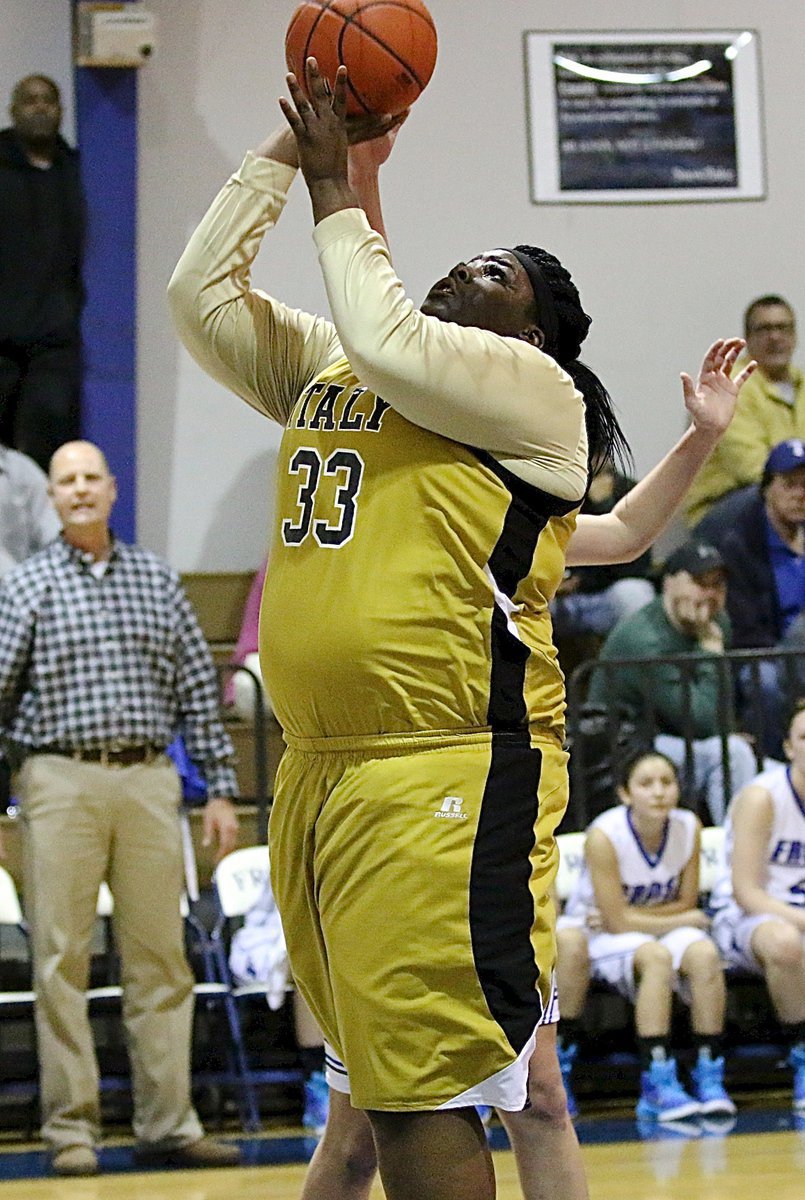 Image: Lady Gladiator Cory Chance(33) takes advantage of good positioning on the offensive boards.