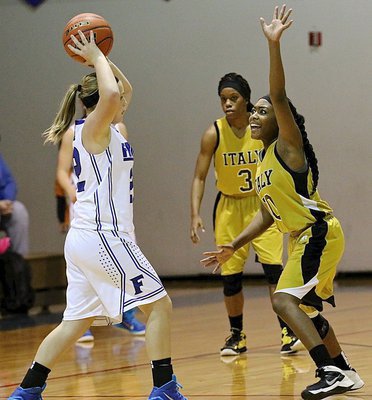 Image: Italy senior K’Breona Davis(10) uses some crazy eyes to put pressure on a Frost ball handler.