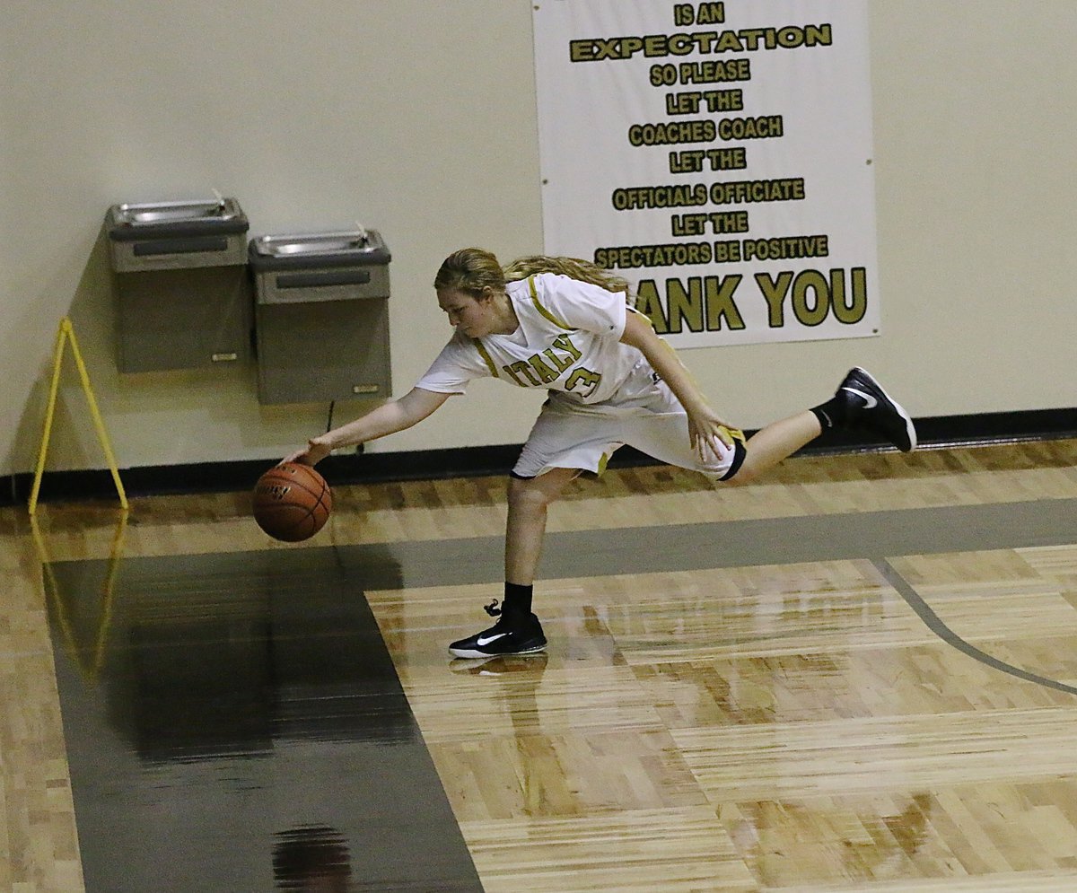 Image: Brycelen Richards(13) attempts to save a ball from going out-of-bounds.