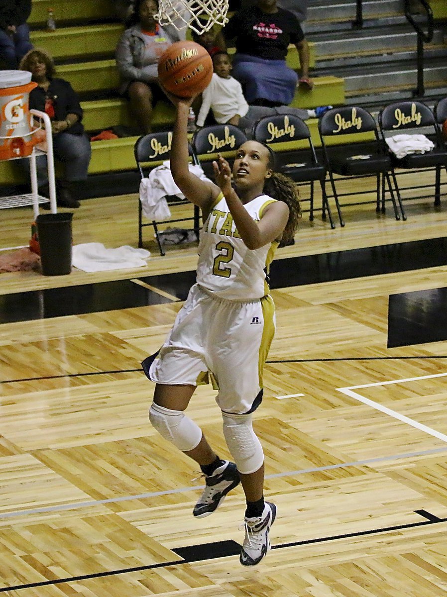 Image: Lady Gladiator Emmy Cunningham(2) finishes the fast break with a lay in.