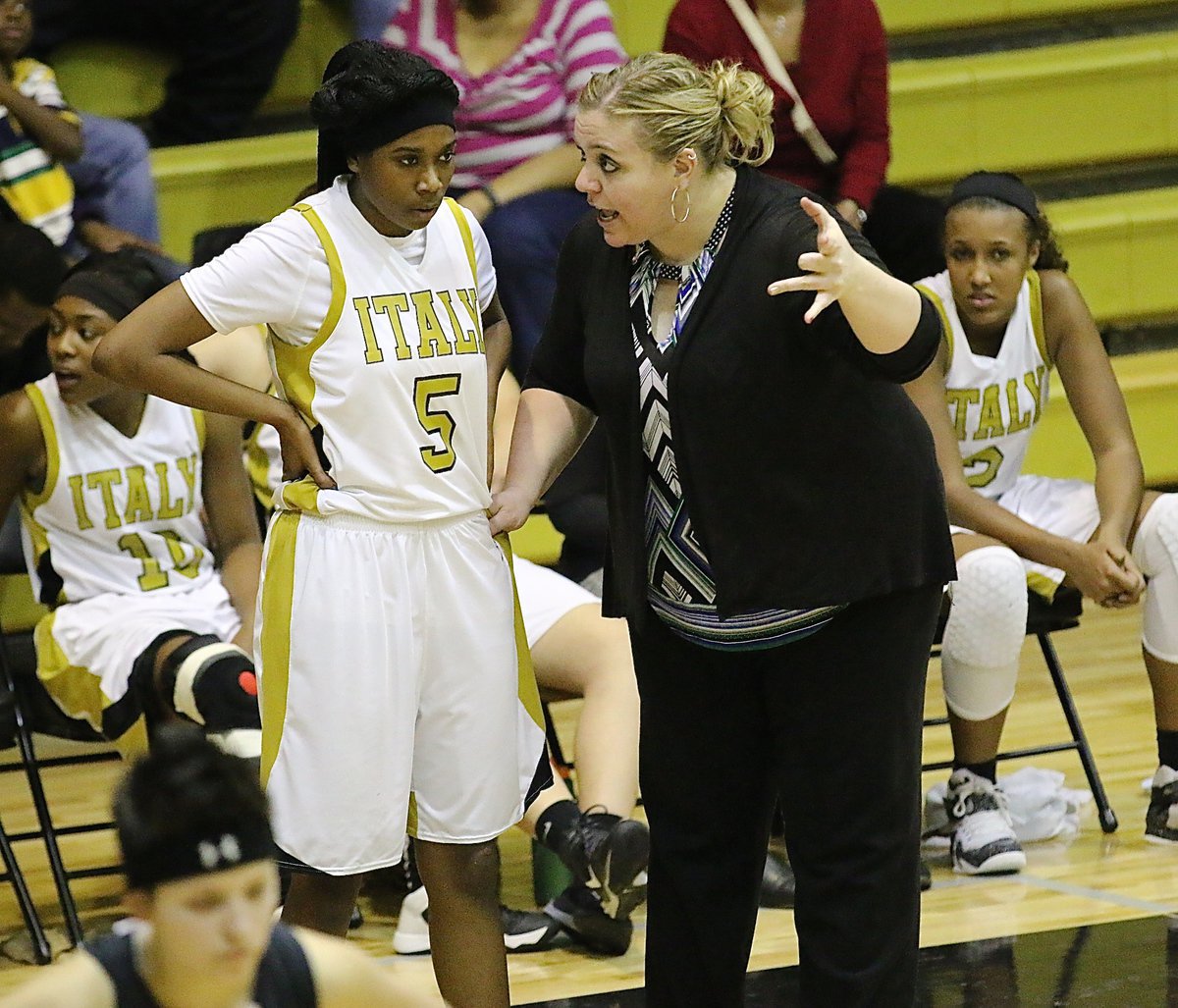 Image: Lady Gladiator Head Coach Melissa Fullmer talks strategy with Janae Robertson(5).