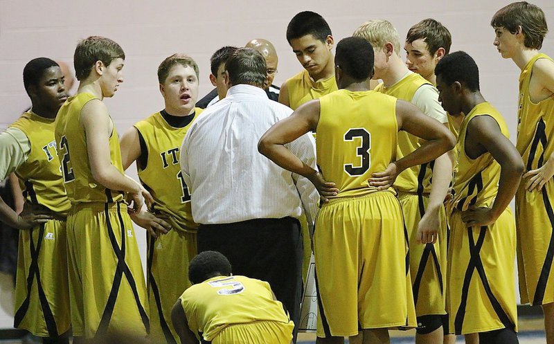 Image: Gladiator head coach Brandon Ganske talks with his guys early in the fourth.