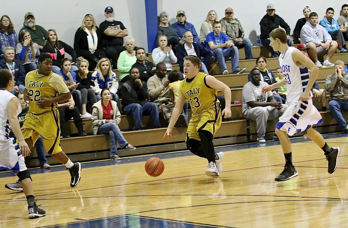 Image: Gladiator guard John Escamilla(13) hustles the ball across court with Kenneth Norwood, Jr. on his wing.