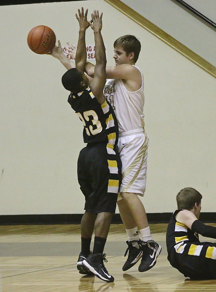 Image: James Walton(11) secures a defensive rebound and then passes to his outlet.