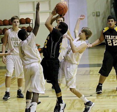 Image: Anthony Lusk(4) and Garrett Janek(12) squeeze a Wampus Cat shooter.