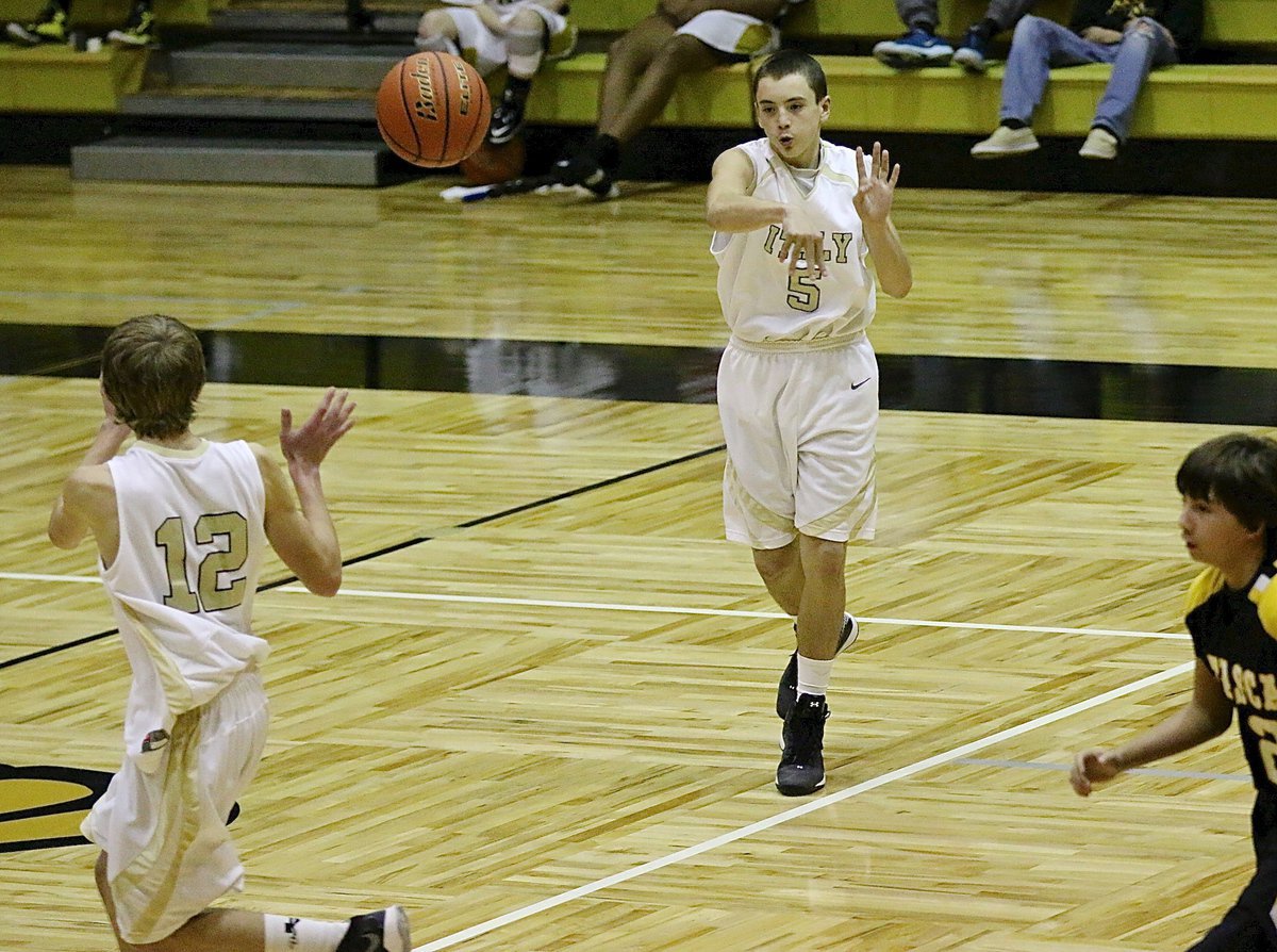 Image: Dylan McCasland(5) passes the ball over to teammate Garrett janek(12).