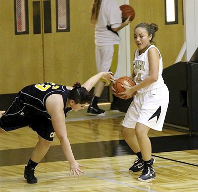 Image: Vanessa Cantu(24) rips away a defensiive rebound from a JV Lady Wampus Cat.