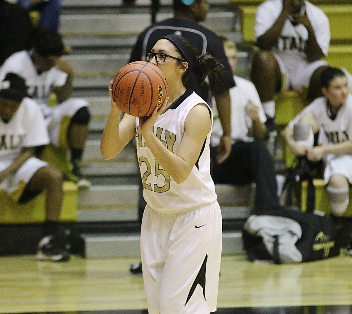 Image: Lizzie Garcia(25) warms up from the arc. Garcia would go on to drop in three 3-pointers against Itasca and finish with 9-points.