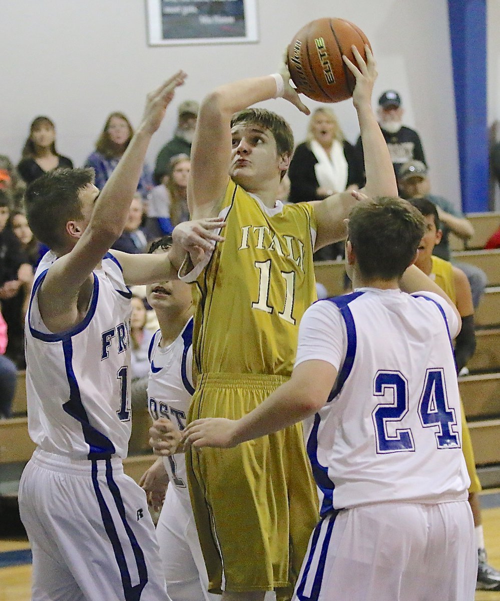 Image: James Walton(11) asserts his will in the offensive paint for Italy.