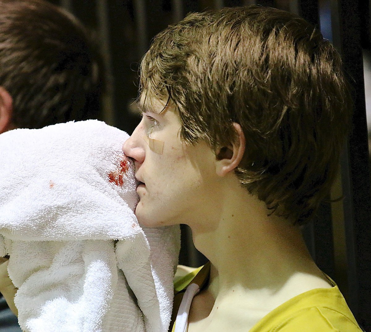 Image: JV Gladiator Garrett Janek(12) needed a towel after taking an elbow to the nose.