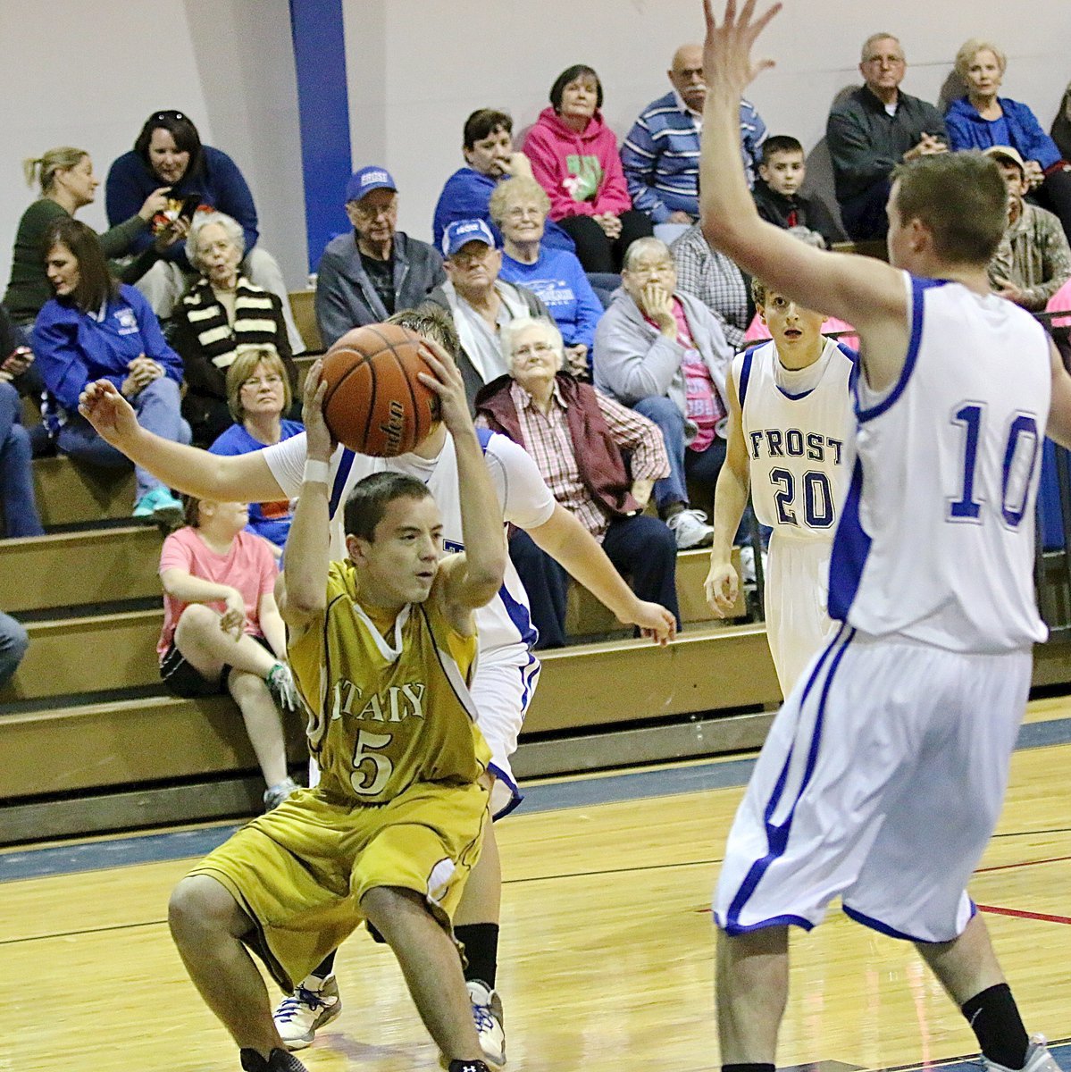 Image: JV Gladiator Dylan McCasland(5) freezes the Frost defense with a ball fake.