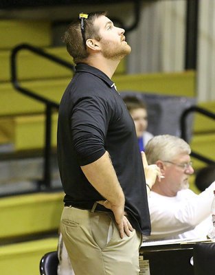 Image: Coach Jon Proud checks the scoreboard while coaching the Italy’s 7th Grade Boys squad against Hubbard.