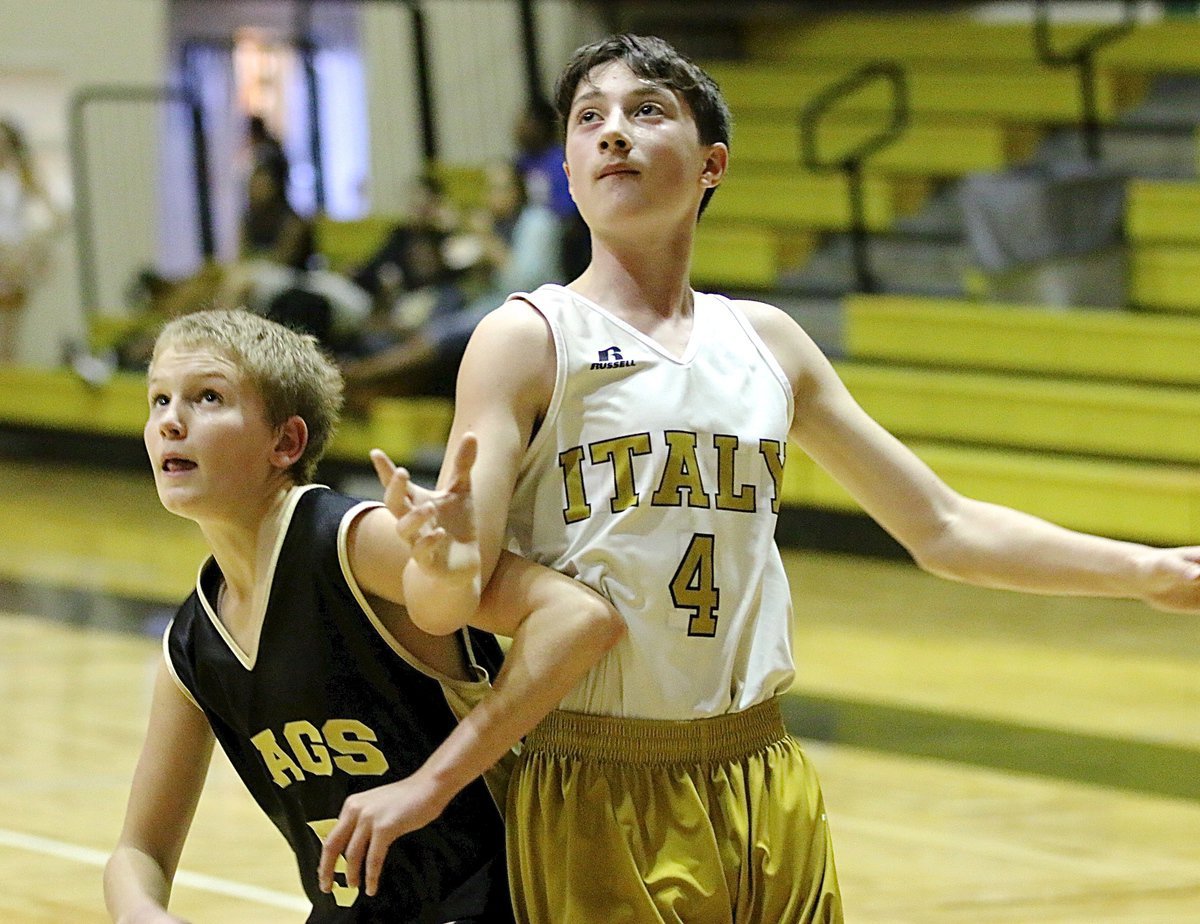 Image: Italy 7th Grader Ryan Dabney(4) battles for position on the low block.