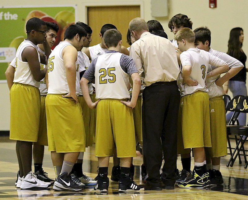 Image: Italy’s 8th Grade head coach Jon Cady has their complete attention during a timeout.