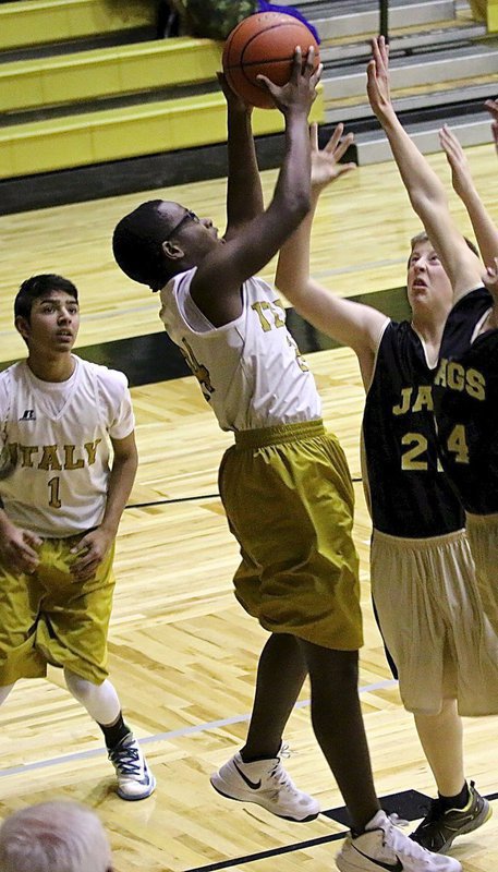 Image: Italy 8th Grader Adam Powell(24) out rebounds the Jags.