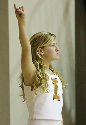 Image: Italy Jr. High Cheerleader Karson Holley encourages Italy’s shooters.