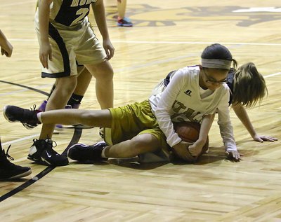 Image: Aliyah Turner(13) scraps for a loose ball against Hubbard.