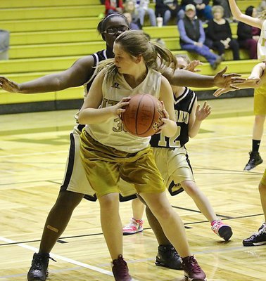 Image: Courtni Bland(30) backs down a Hubbard defender in an effort to score.