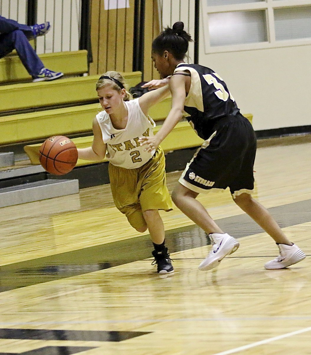 Image: Italy A team Karson Holley(2) stays in bounds while warding off a Hubbard defender. Strong stuff!