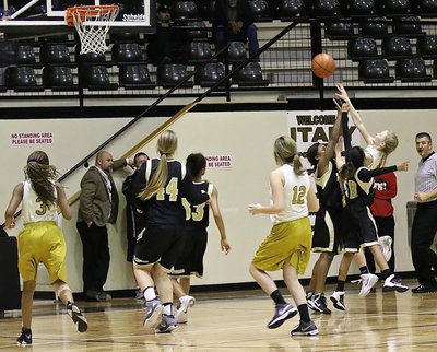 Image: Taylor Boyd(5) attempts a jumper while teammates Chardonae Talton(3) and Hannah Haight(12) move in to rebound.