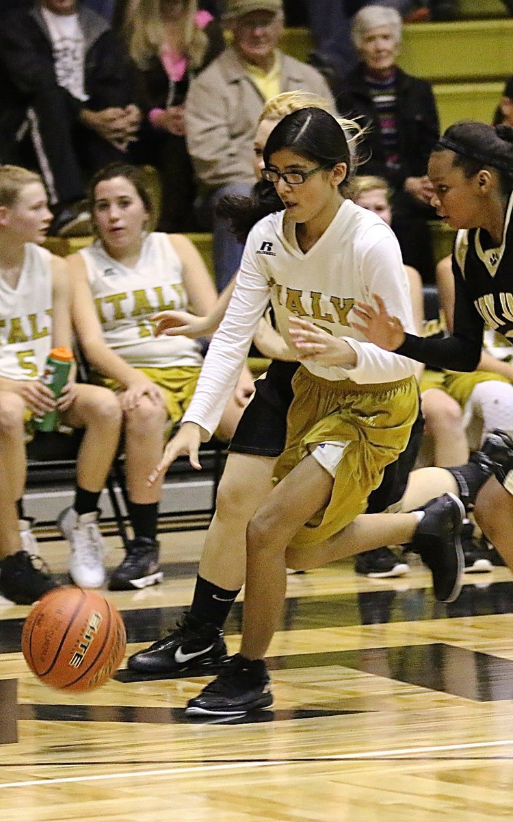 Image: Italy A team guard Andrea Galvan(20) dribbles as fast she can toward her goal.