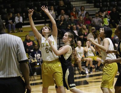 Image: Cassidy Gage(24) scores a layup with teammate Emily Guzman(15) backing her up.