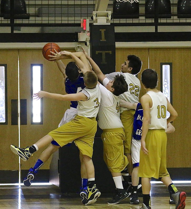 Image: Not in our lane! Garrett Cash(3), Mickey South(44) and Jonathan Salas(22) deny a Lion shooter access to an easy bucket.