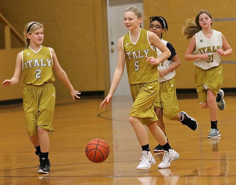 Image: Italy A team’s Taylor Boyd(5) brings the ball down the floor as teammate Karson Holley(2) fills the wing.