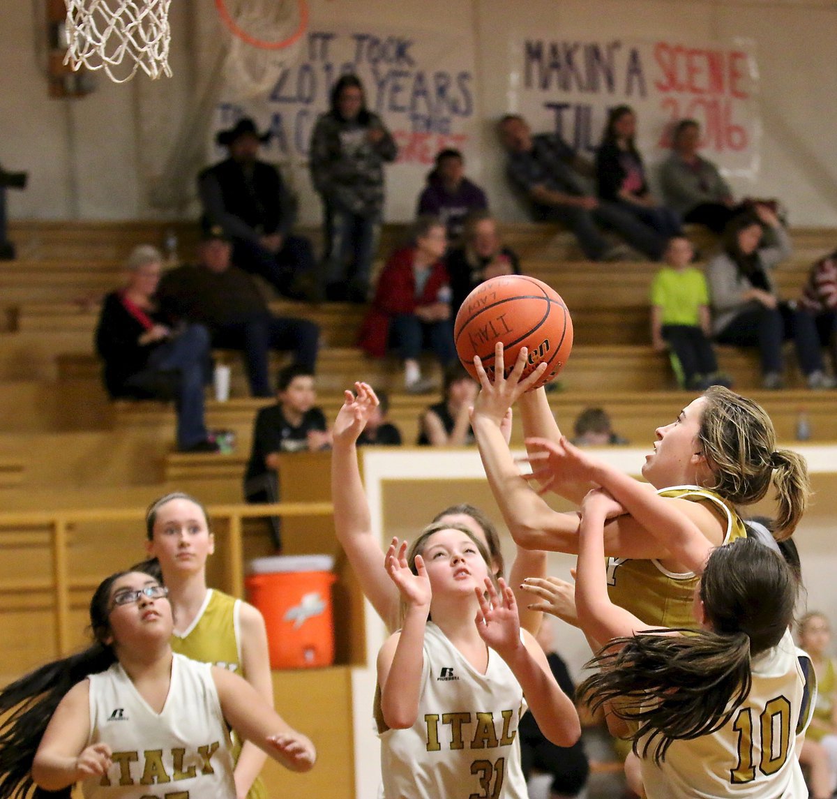 Image: Italy A team’s Hannah Haight(11) is fouled on the way up to the basket.