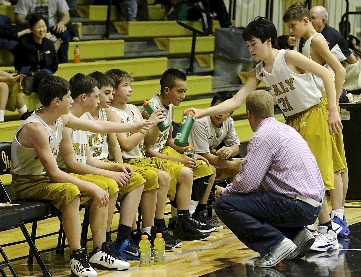 Image: Italy 7th grade boys head coach Jon Cady talks to Ryan Dabney, Hunter Hinz, Colby Hampton, Tanner Chambers, Matthew Monreal, Jesus Enriquez, Cade Tindol and Zach Sandlin during a team timeout.