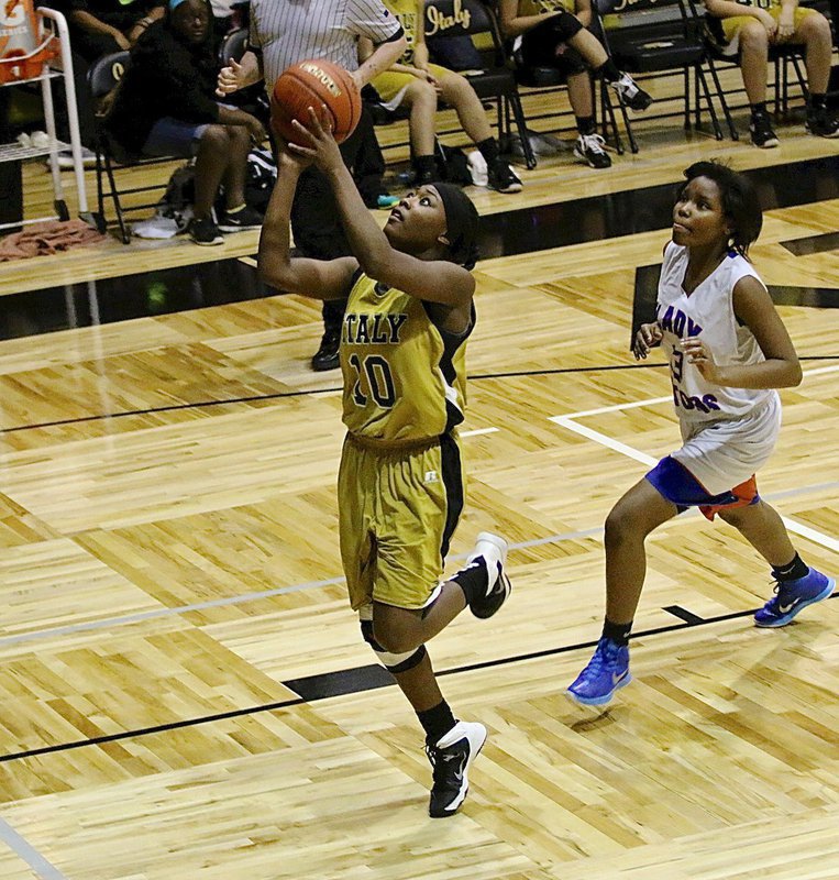 Image: Italy’s K’Breona Davis(10) finishes the fast break.