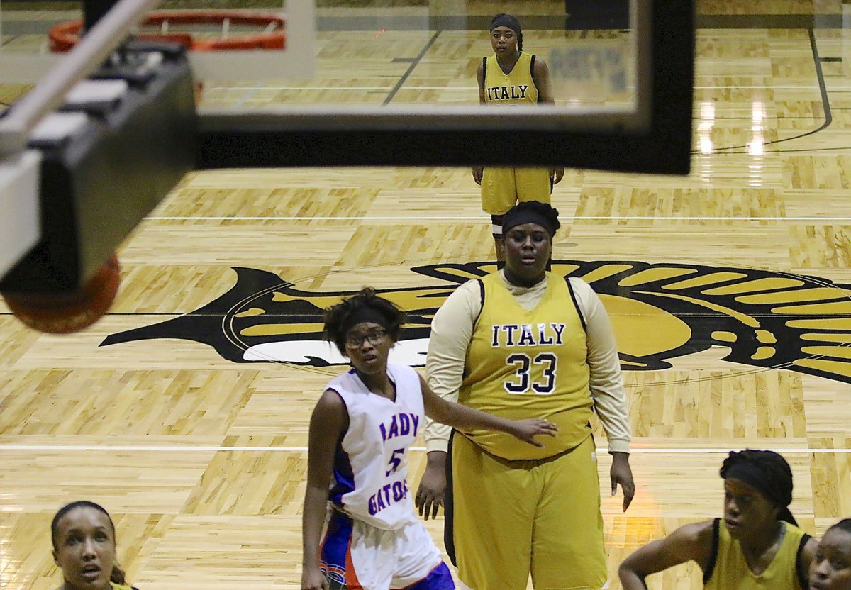 Image: Lady Gladiator Cory Chance(33) watches a free-throw swish thru the basket.