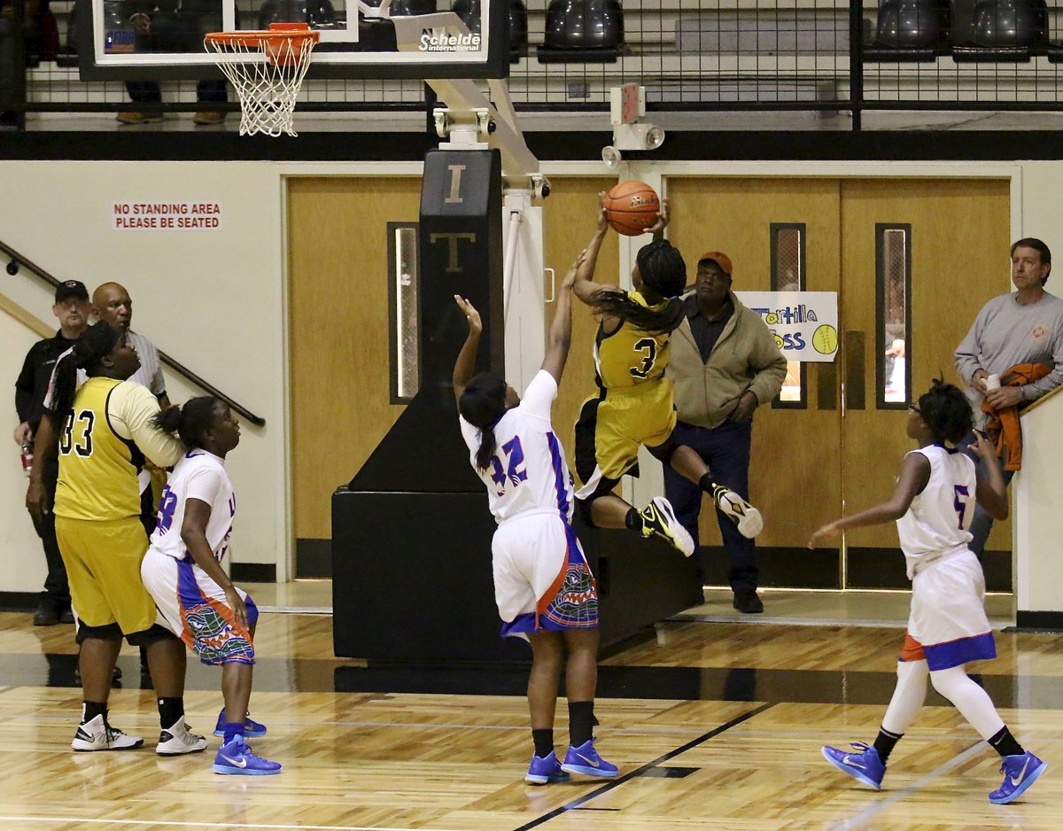 Image: Somebody throw in the towel already! Dallas Gateway checked out early with Kortnei Johnson(3) jabbing away at the Lady Gladiators.