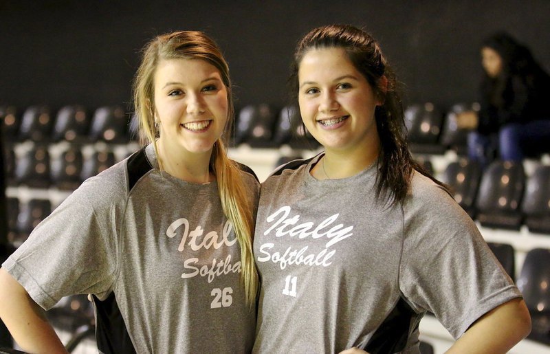 Image: Softball players Sydney Weeks and Jenna Holden are in the upper deck of the Coliseum to cheer on their fellow Lady Gladiators.