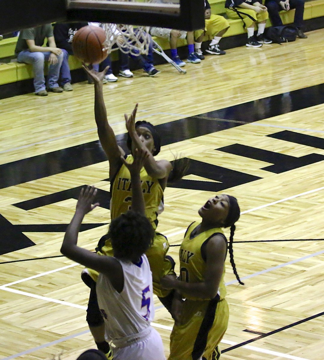 Image: An assist from Emmy Cunningham allows Kortnei Johnson(3) an easy lay in, much to the delight of teammate K’Breona Davis(10) who likes the team work.