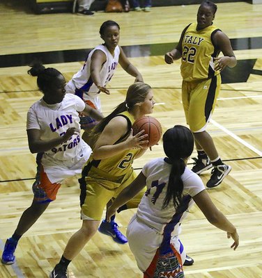 Image: Lady Gladiator, Lillie Perry(24) snags an offensive rebound and then maneuvers around to dish an assist to Kortnei Johnson.
