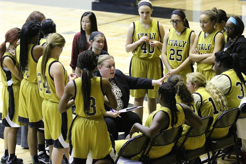 Image: Lady Gladiator head coach Melissa Fullmer gets everyone squared away during a timeout.