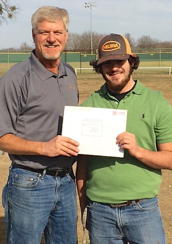 Image: Italy Athletic Director/Head Football Coach Charles Tindol presented senior Gladiator football player Kyle “Catfish” Fortenberry with his acceptance package to participate in the 7th Annual Fellowship of Christian Athletes Super Centex Victory Bowl All-Star game this summer in Waco.