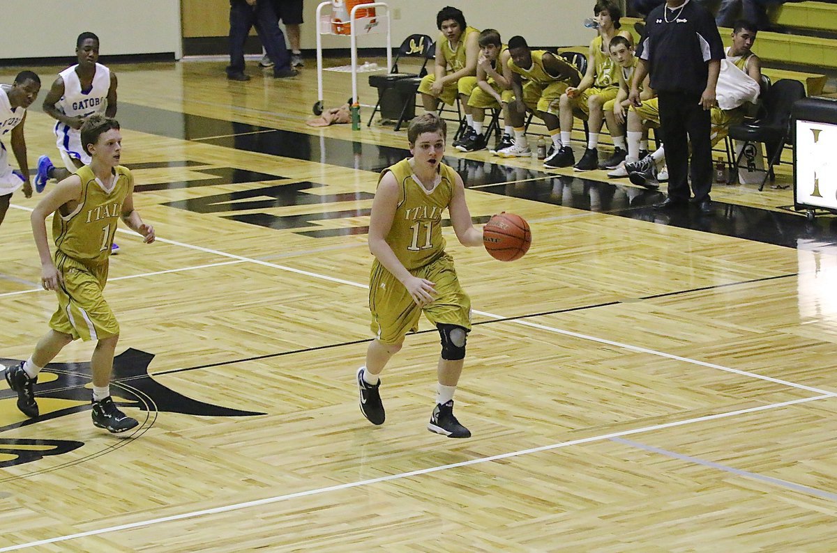 Image: James Walton(11) finishes the fast break with a 2-point lay up for Italy JV Gladiators.